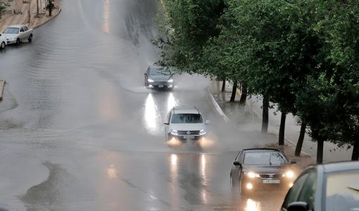 أمطار في أحد شوارع عمان | بترا